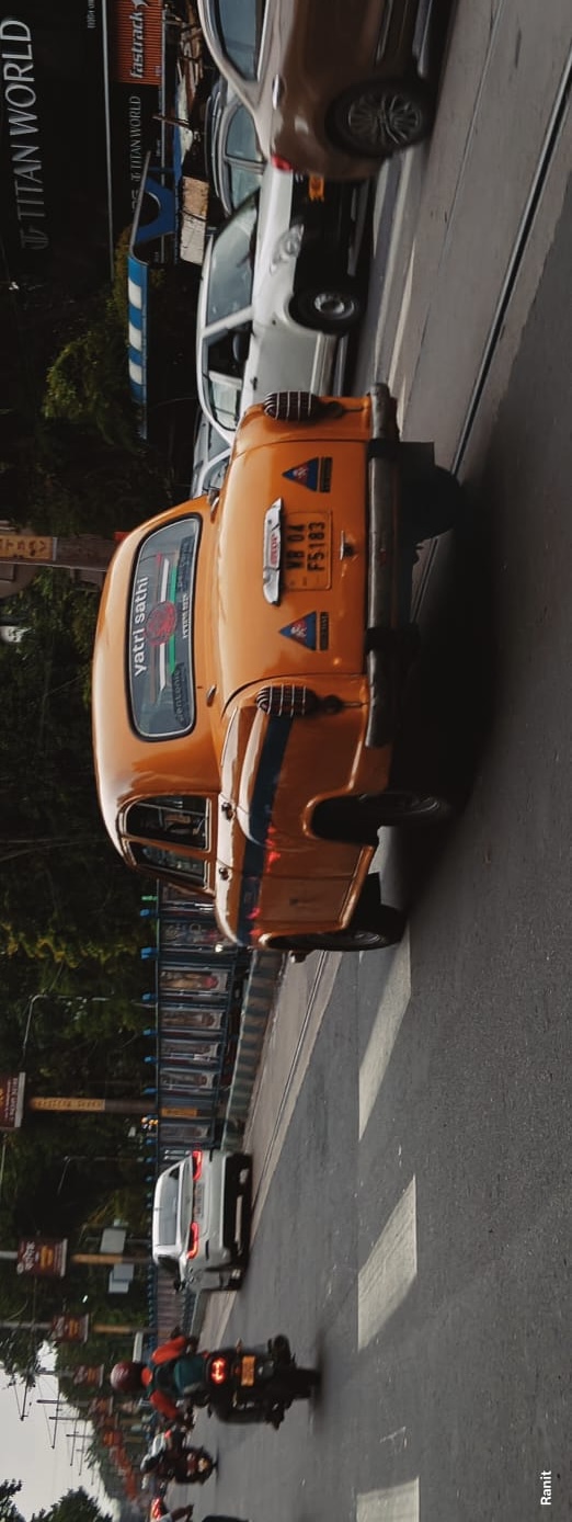 se-up of an orange vintage car in natural light